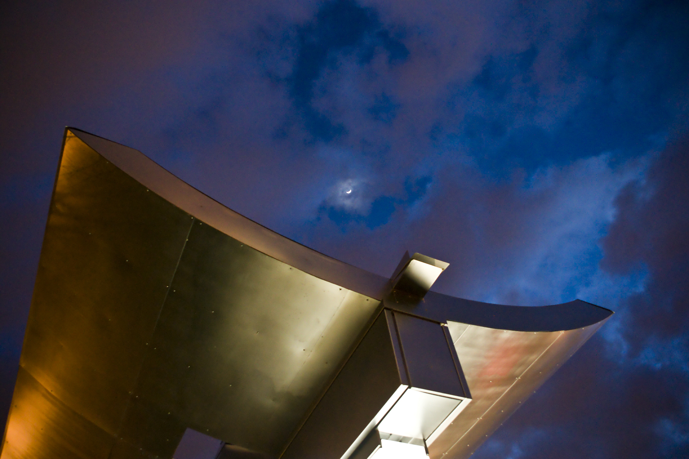 Bus stop structure with clouds and moon